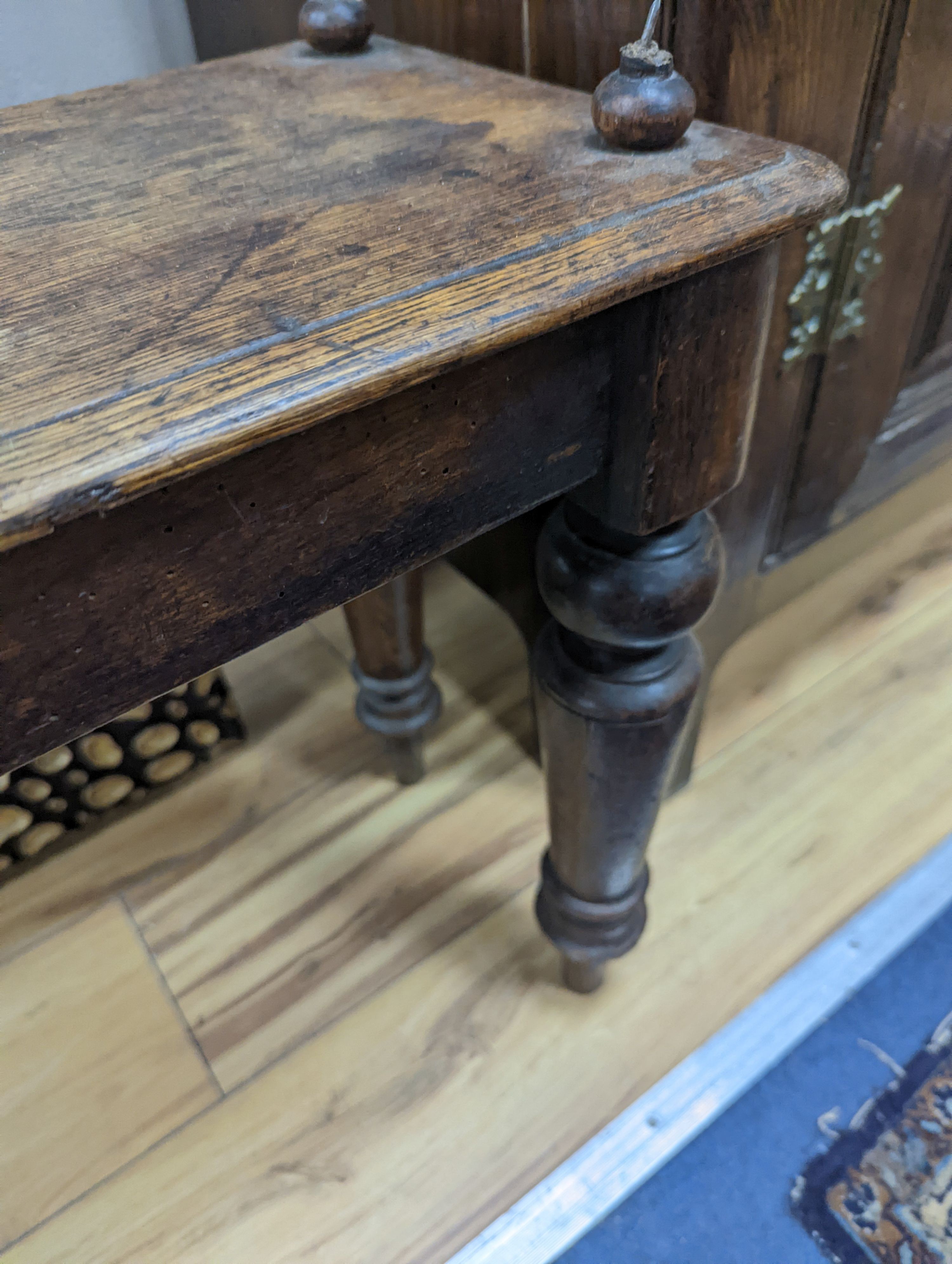 A Victorian oak window seat W-107cm, D-28cm, H-53cm, one handle bar detached but present